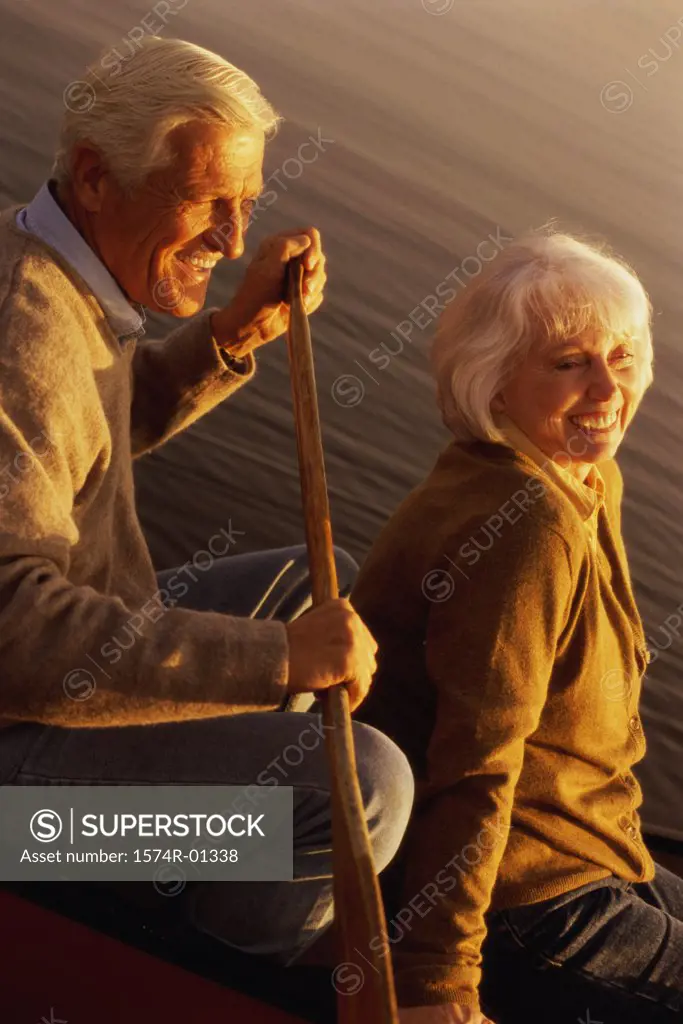 Senior couple sitting in a row boat
