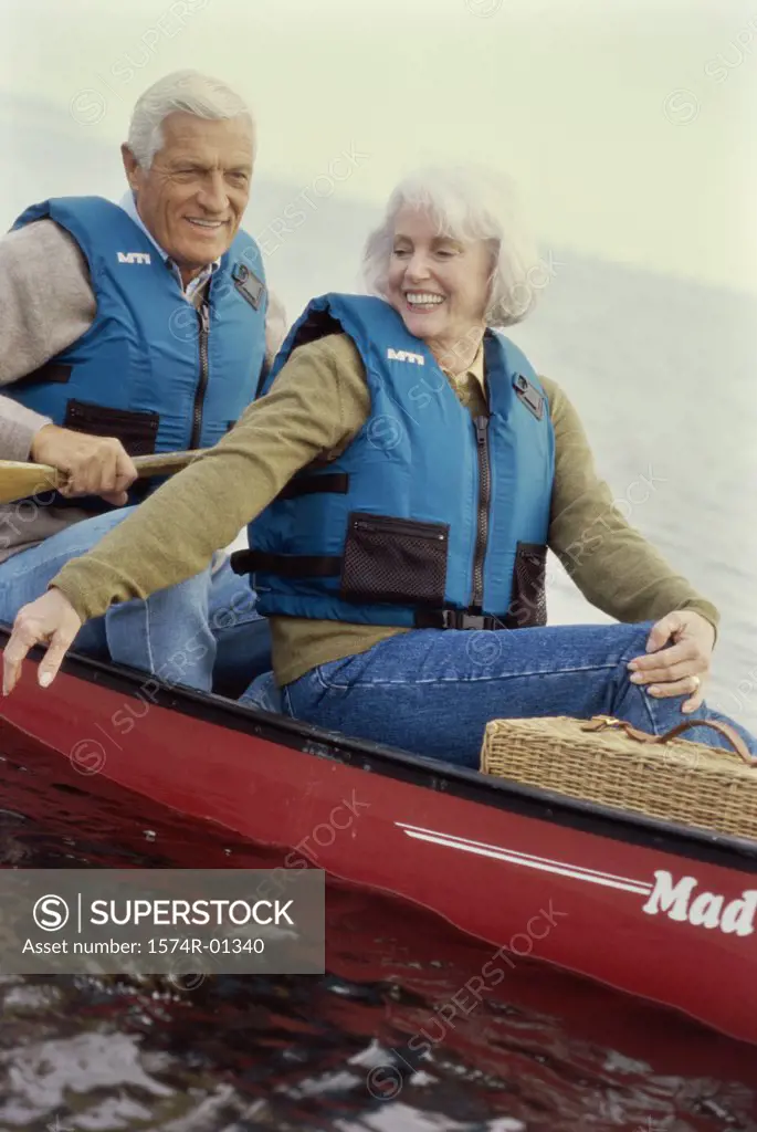 Senior couple sitting in a row boat