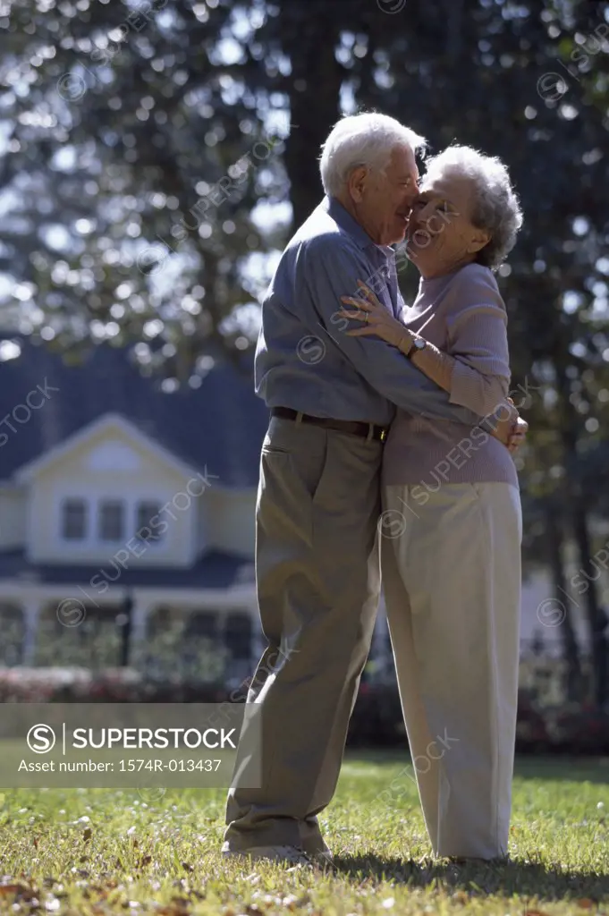 Side profile of a senior couple embracing