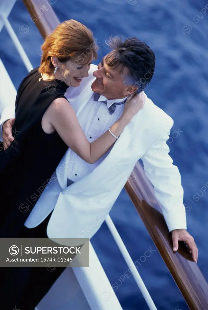 Couple holding each other on a ship