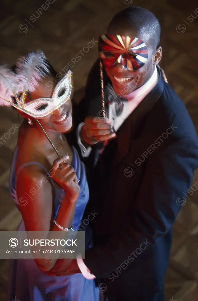 High angle view of a young couple wearing masks