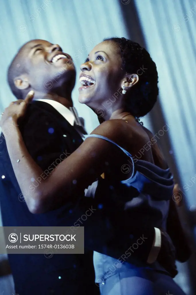 Side profile of a young couple dancing