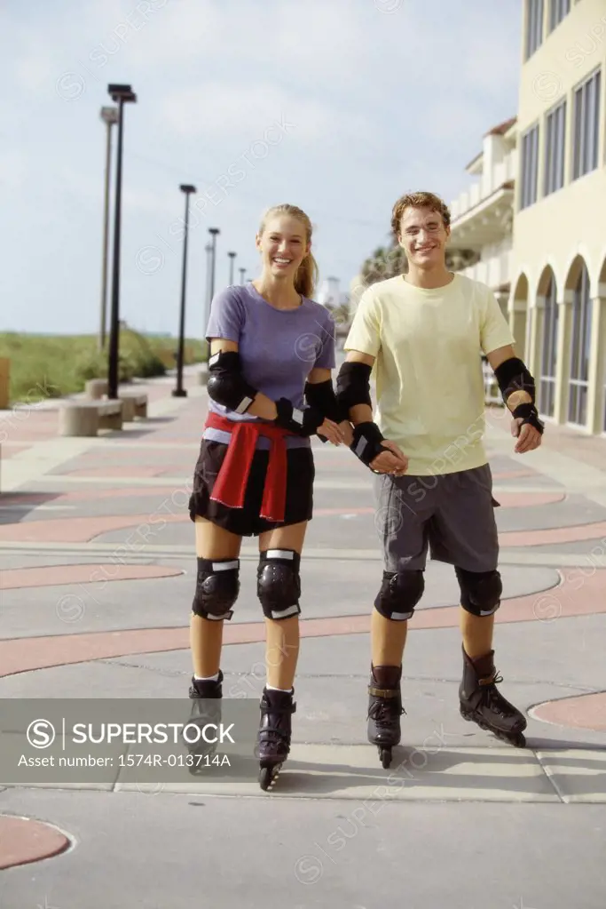 Portrait of a young couple inline skating