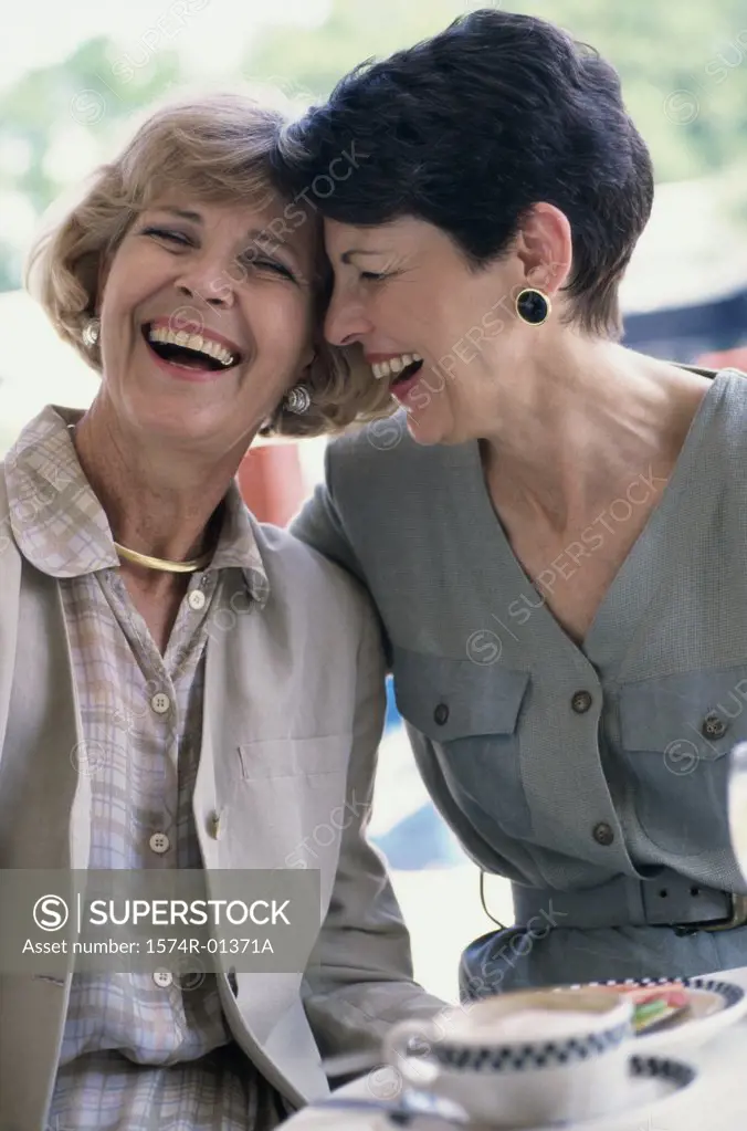 Two mature women laughing