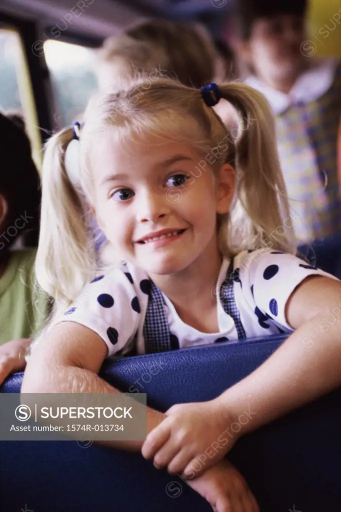 Close-up of a girl sitting in a school bus