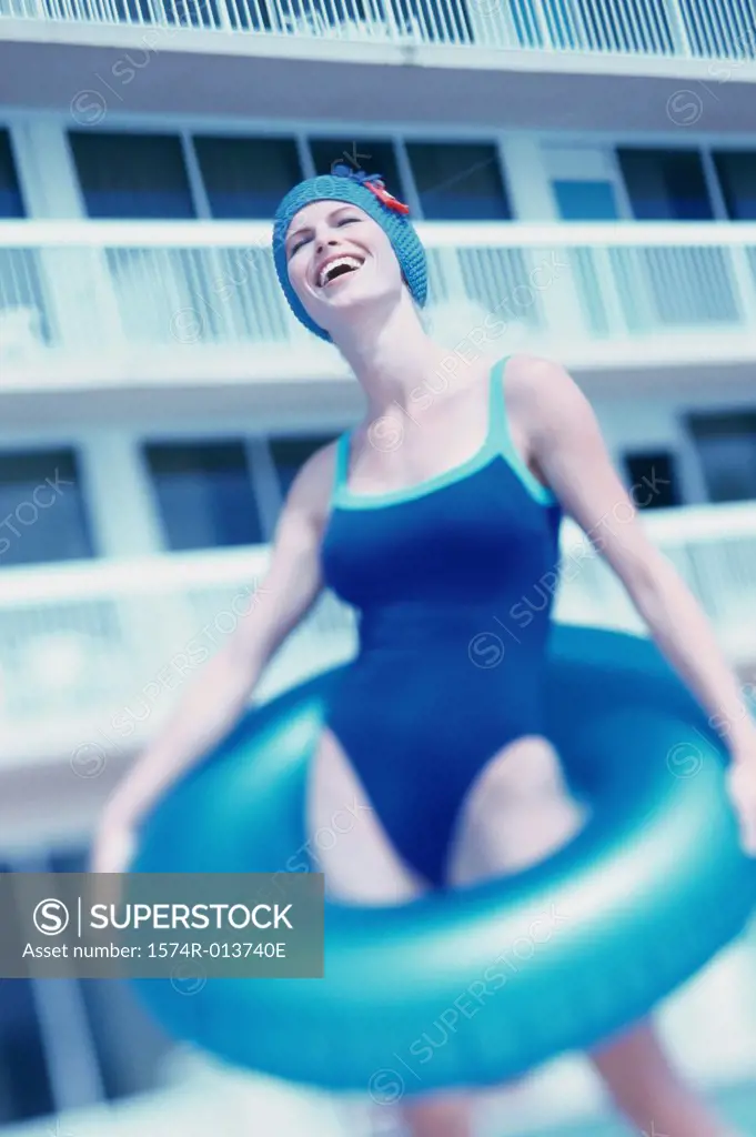 Close-up of a young woman holding an inflatable ring