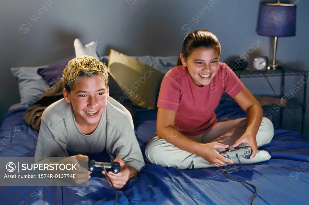 Brother and sister playing video games