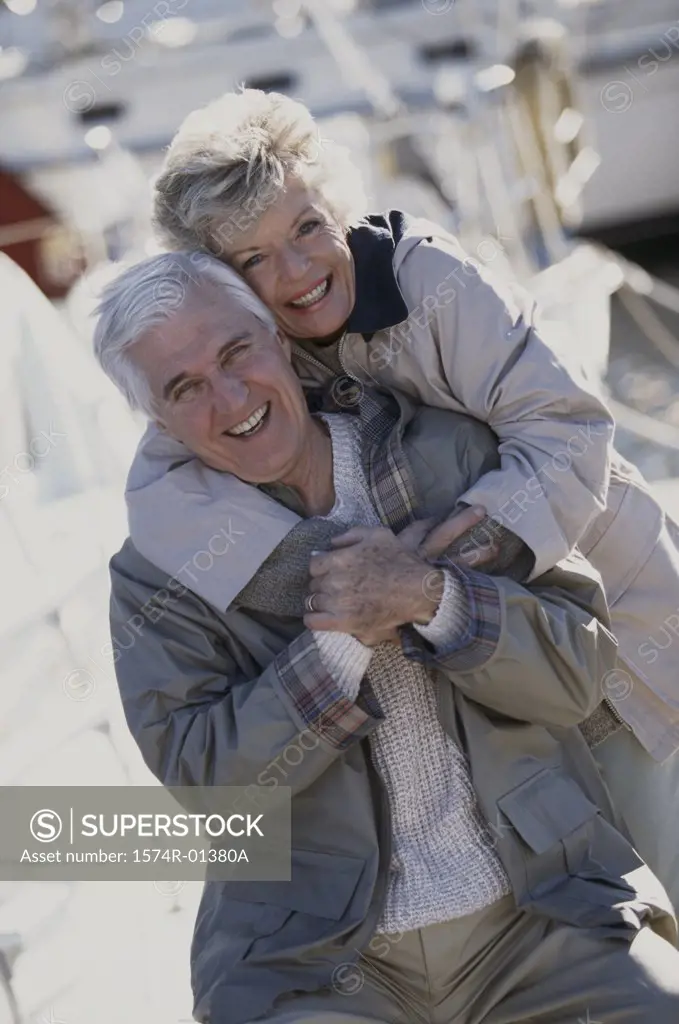 Portrait of a senior couple holding each other smiling