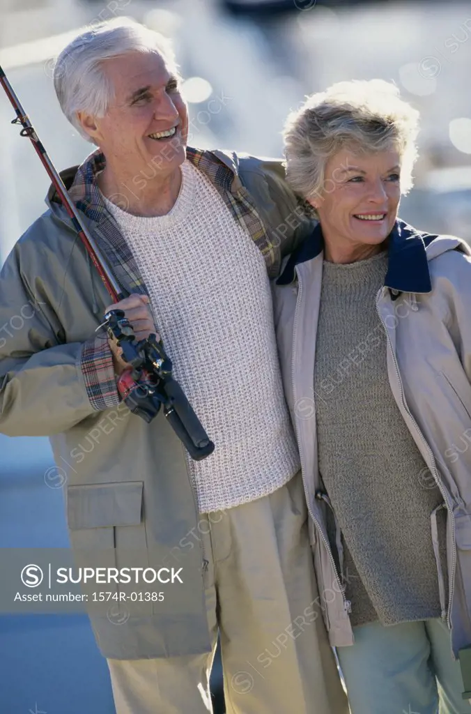 Senior couple holding a fishing rod