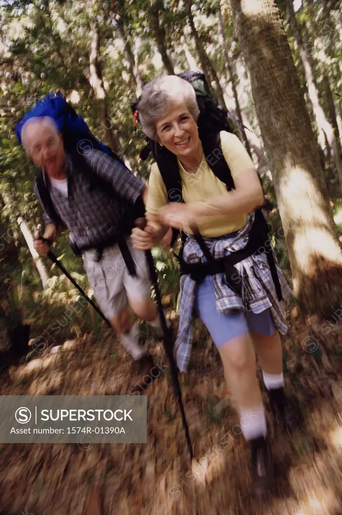 Portrait of a senior couple hiking in the woods