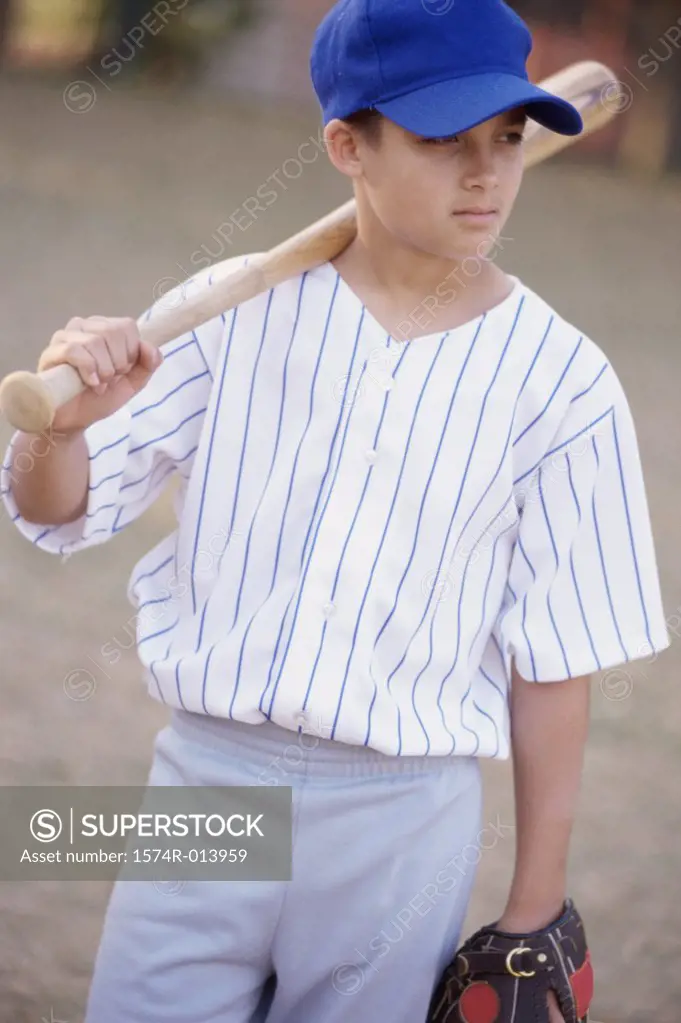 Close-up of a boy holding a baseball bat