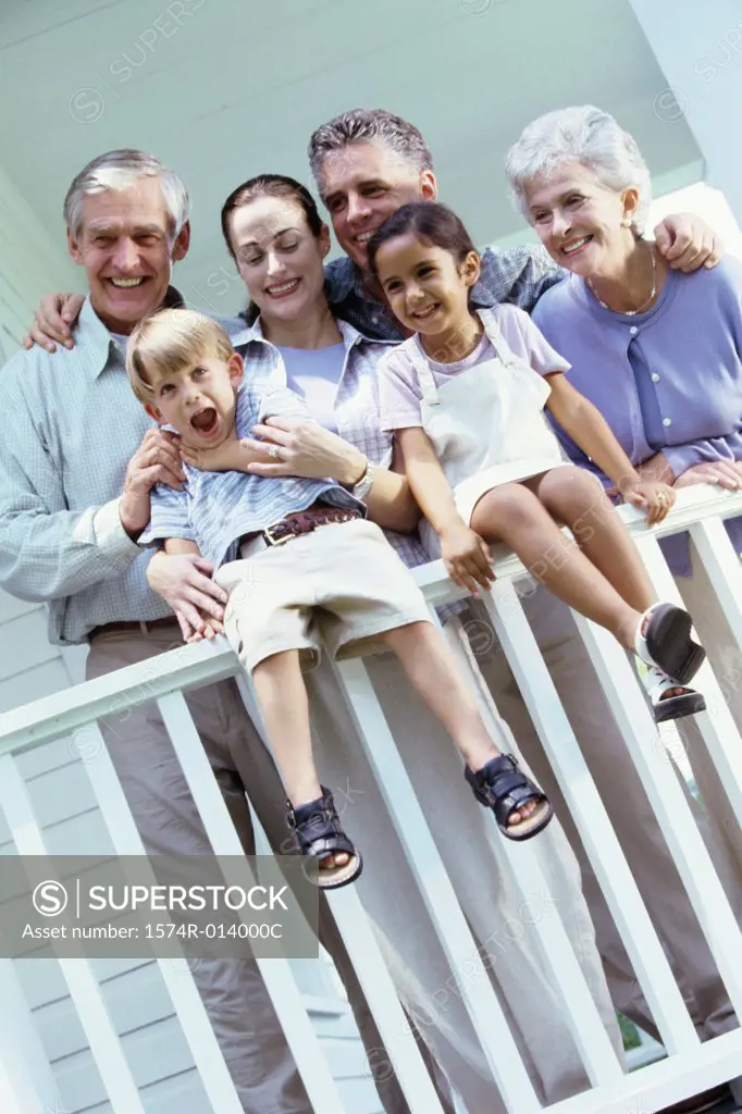 Low angle view of a family near a banister