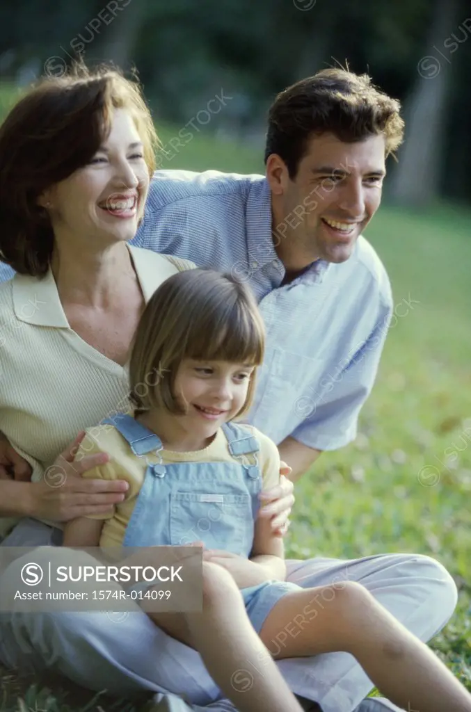 Close-up of parents with their daughter smiling