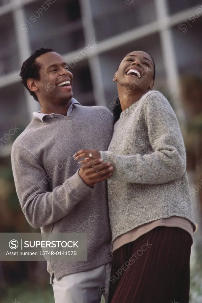 Low angle view of a mid adult couple laughing