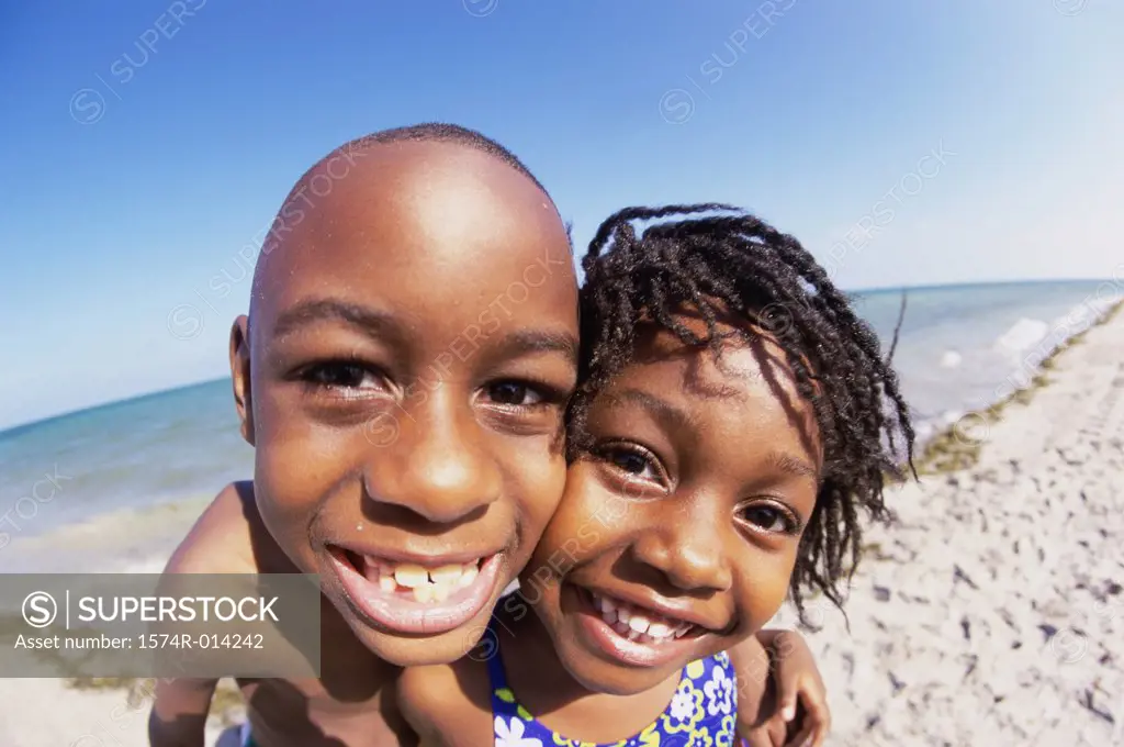 Portrait of a brother and sister on the beach