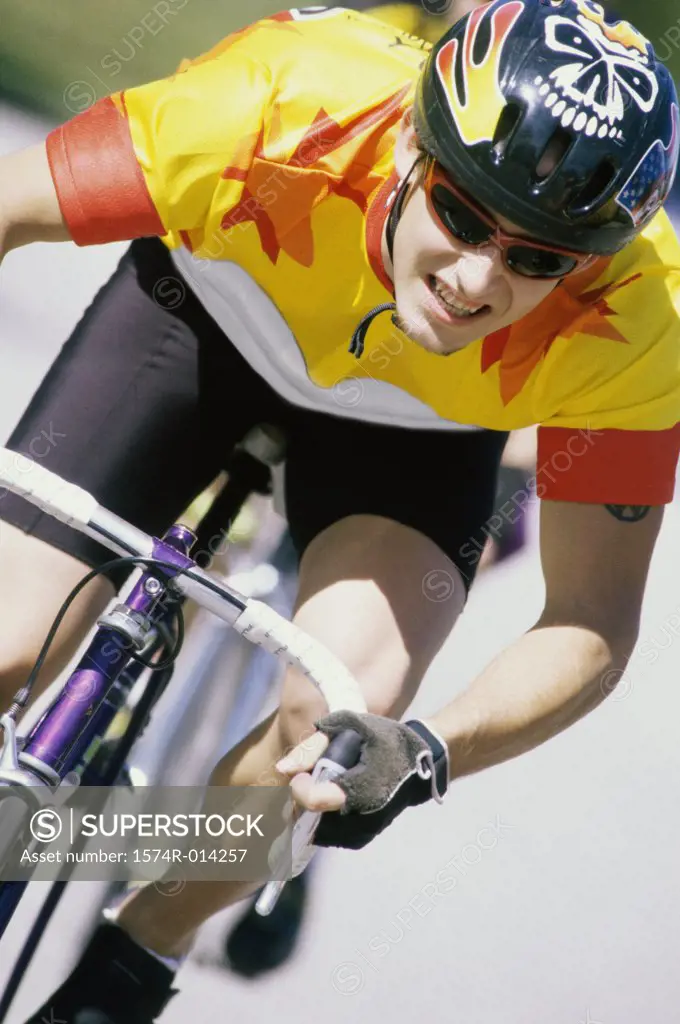 Close-up of a young man cycling