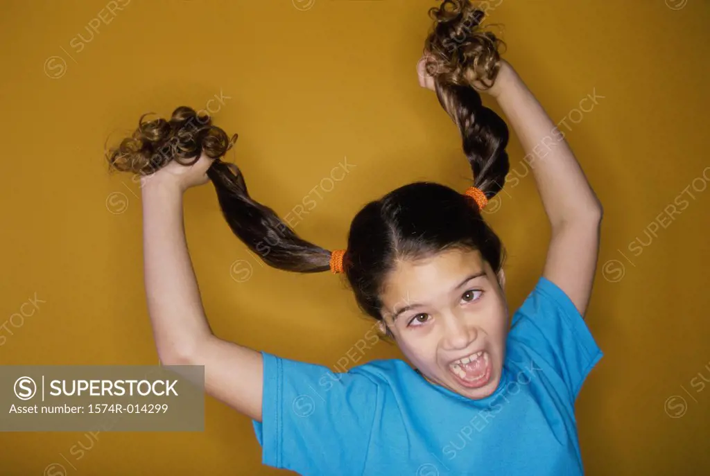 Close-up of a girl pulling her hair