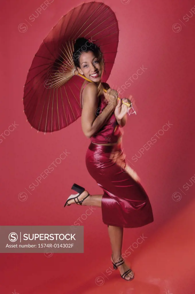 Portrait of a young woman holding a parasol