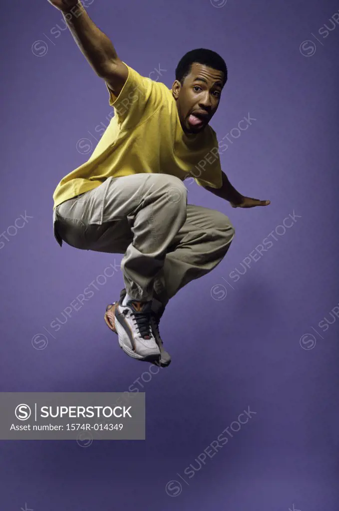 Portrait of a young man jumping