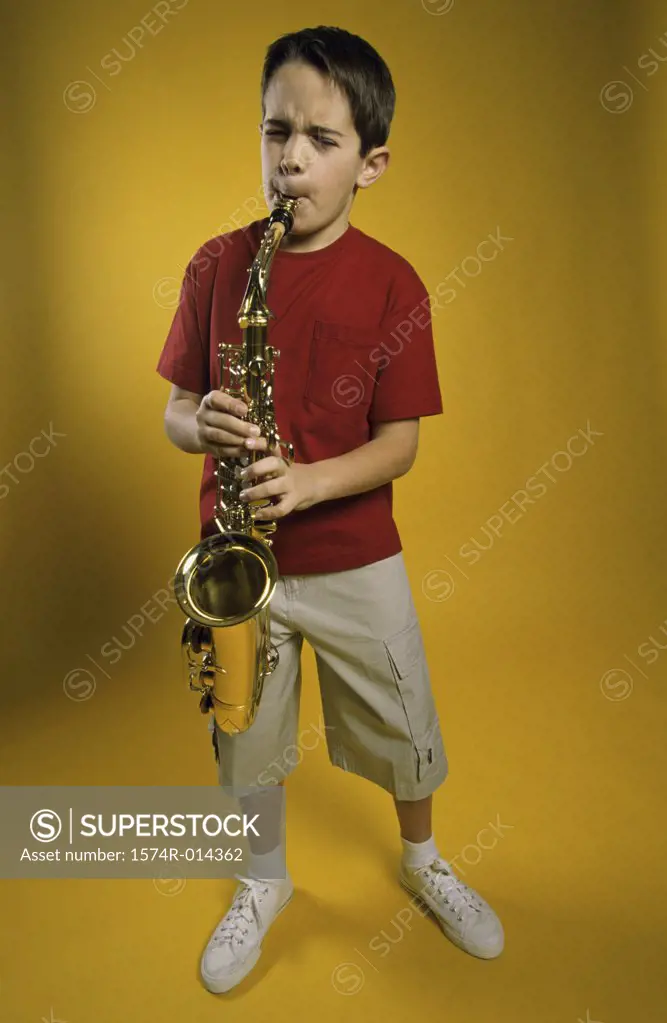 Boy playing a saxophone
