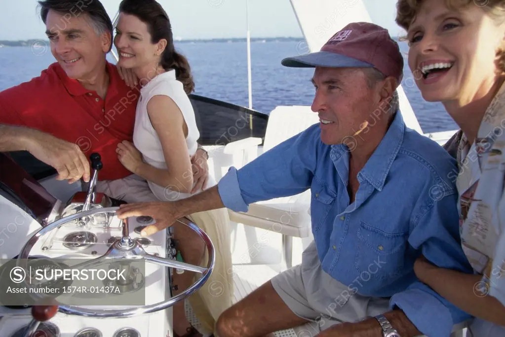 Side profile of two mature couples on a boat
