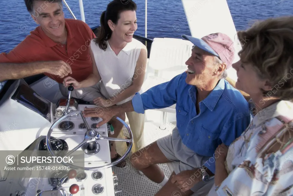 Side profile of two mature couples on a boat
