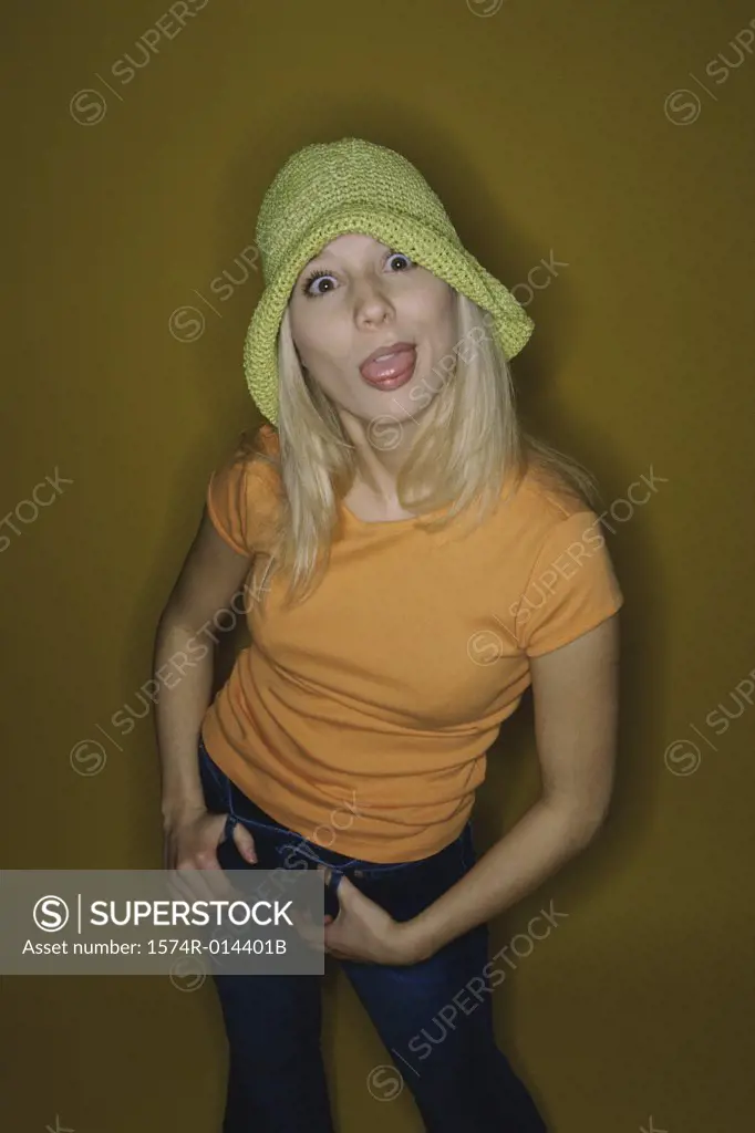 Portrait of a teenage girl sticking her tongue out
