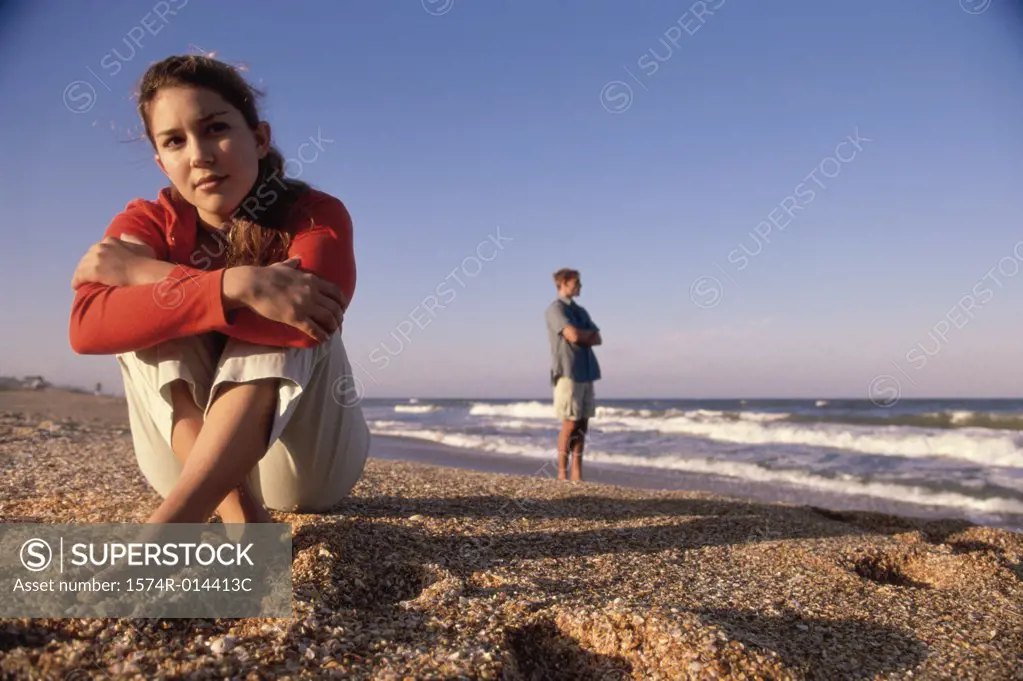 Close-up of a teenage girl sitting on the beach