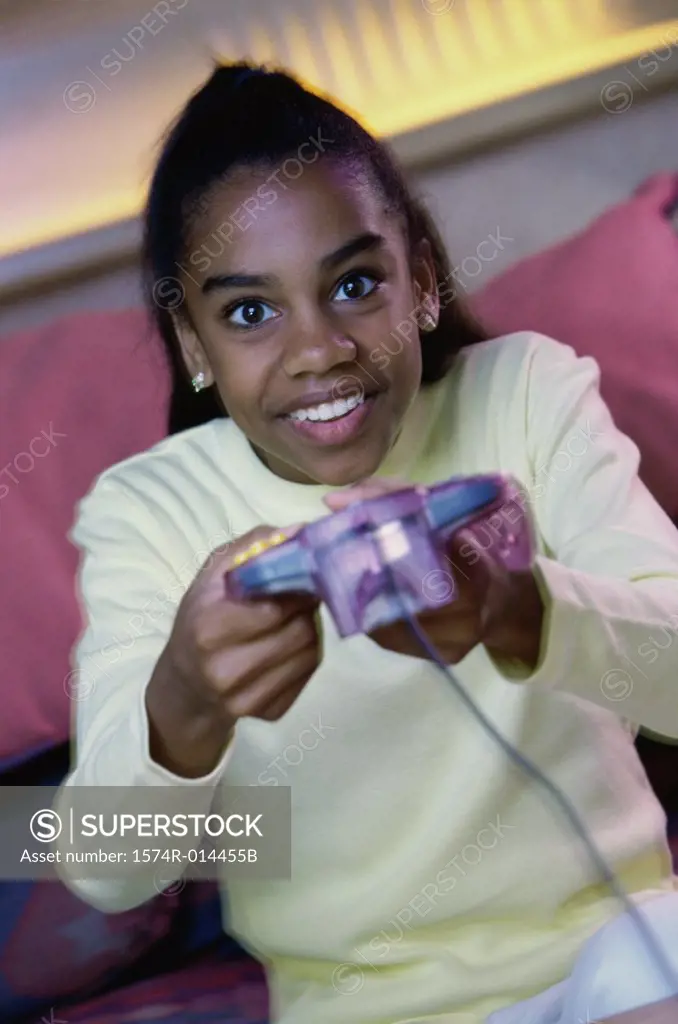 Teenage girl playing video games
