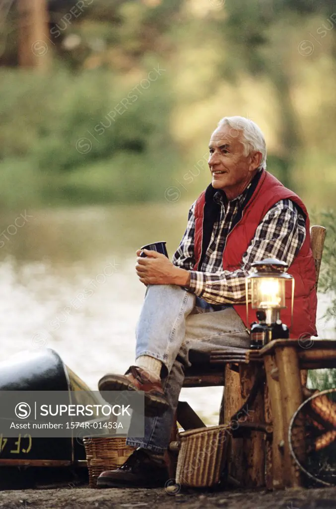 Senior man sitting outdoors on a chair