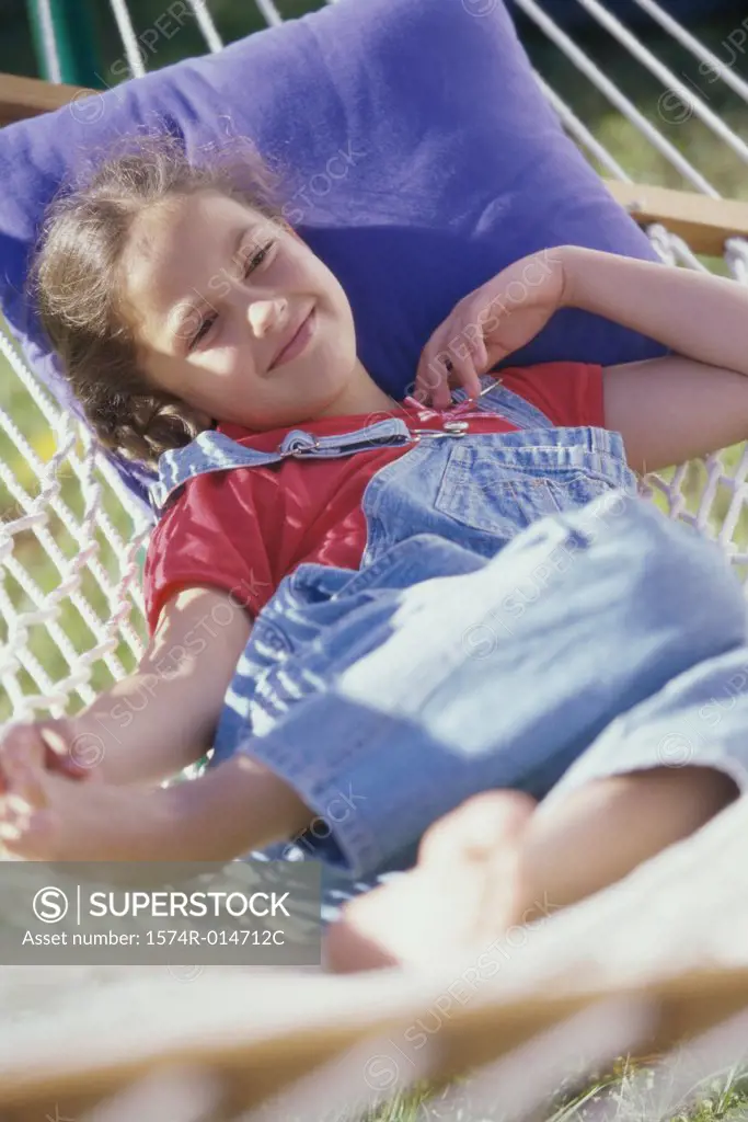 Girl lying in a hammock