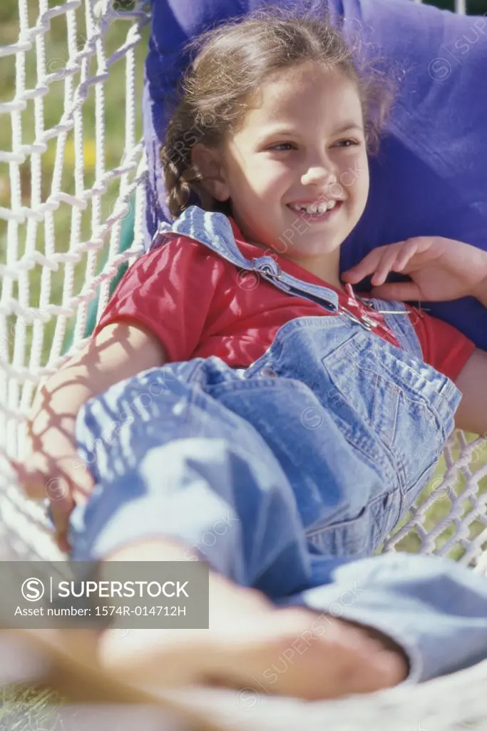 Girl lying in a hammock