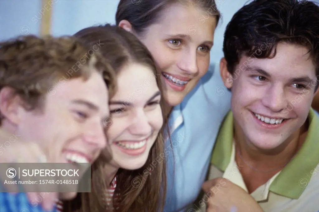 Close-up of a group of teenagers smiling
