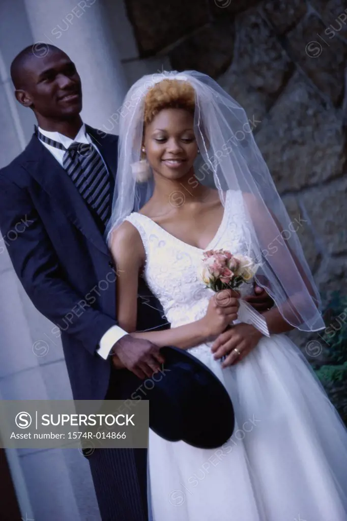 Close-up of a newlywed couple standing