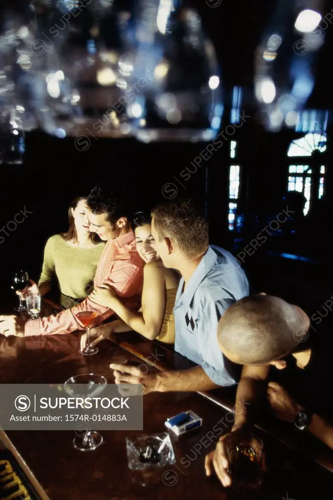 High angle view of five people at a bar