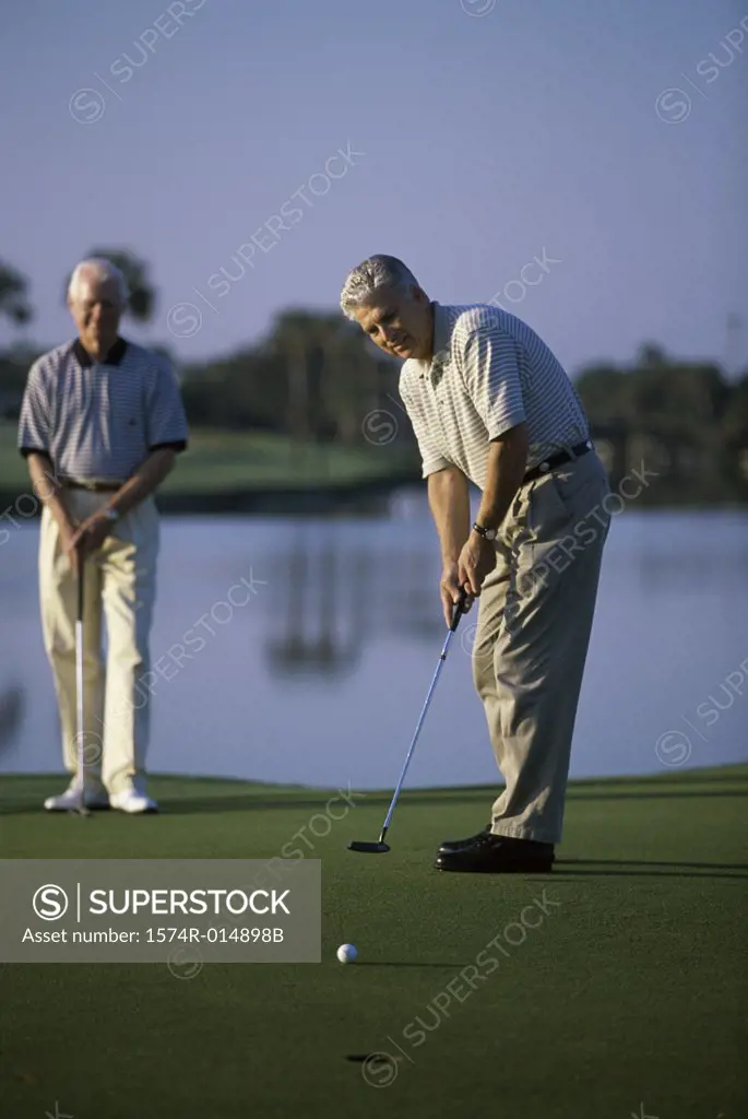 Two senior men playing golf