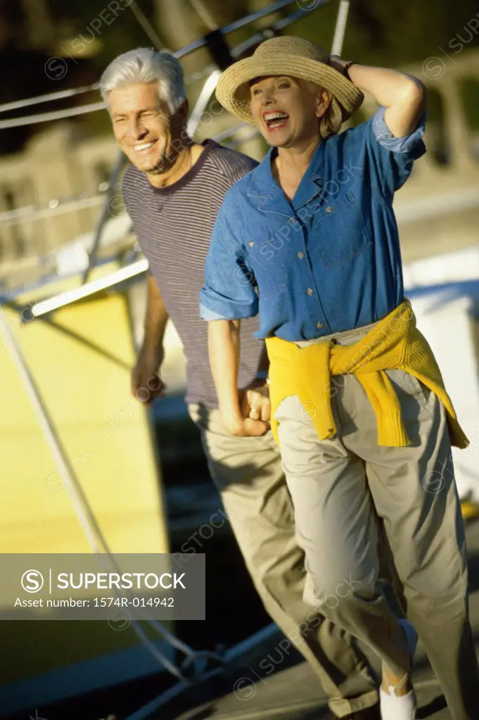 Senior couple walking on a boat
