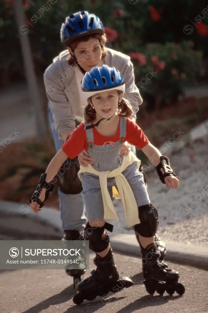 Mother and her daughter inline skating