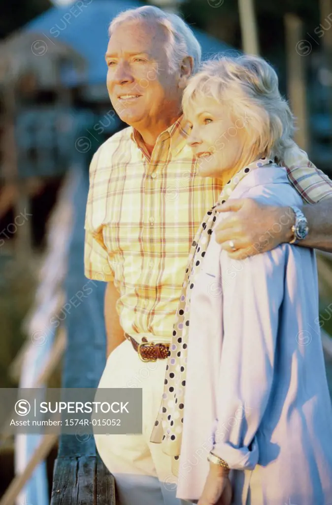 Side profile of a senior couple standing together