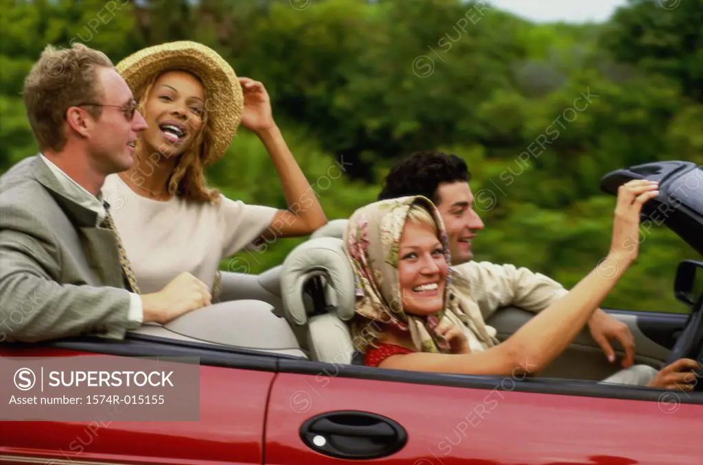 Side profile of two young couples sitting in a car