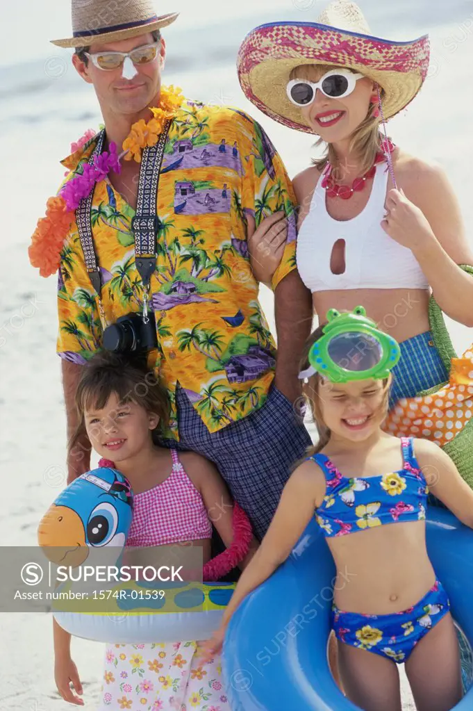 Father and mother with their children at the beach