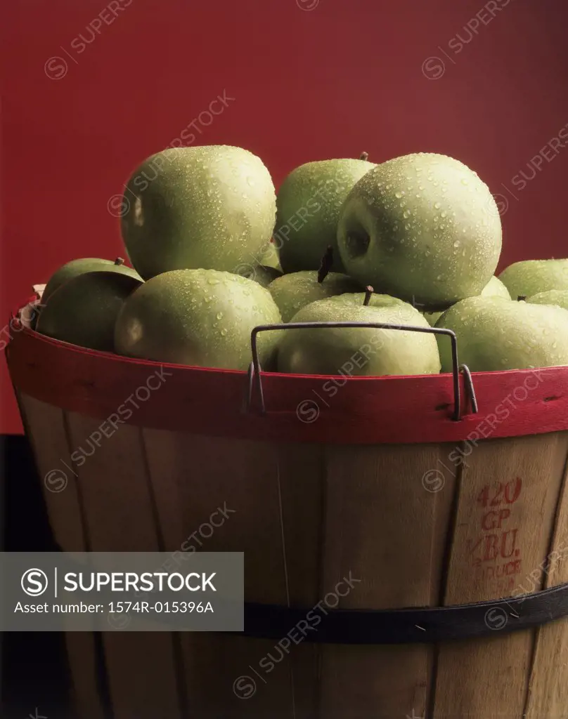 Close-up of green apples in a basket