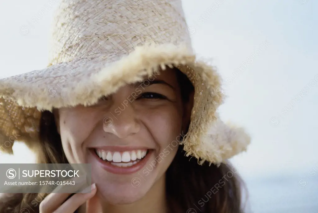Portrait of a teenage girl wearing a hat