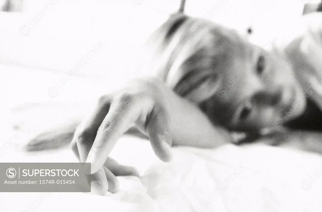Teenage girl lying on a bed