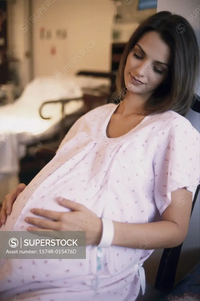 Pregnant woman looking sideways