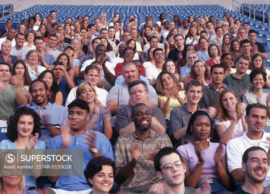 Group of spectators in a stadium cheering