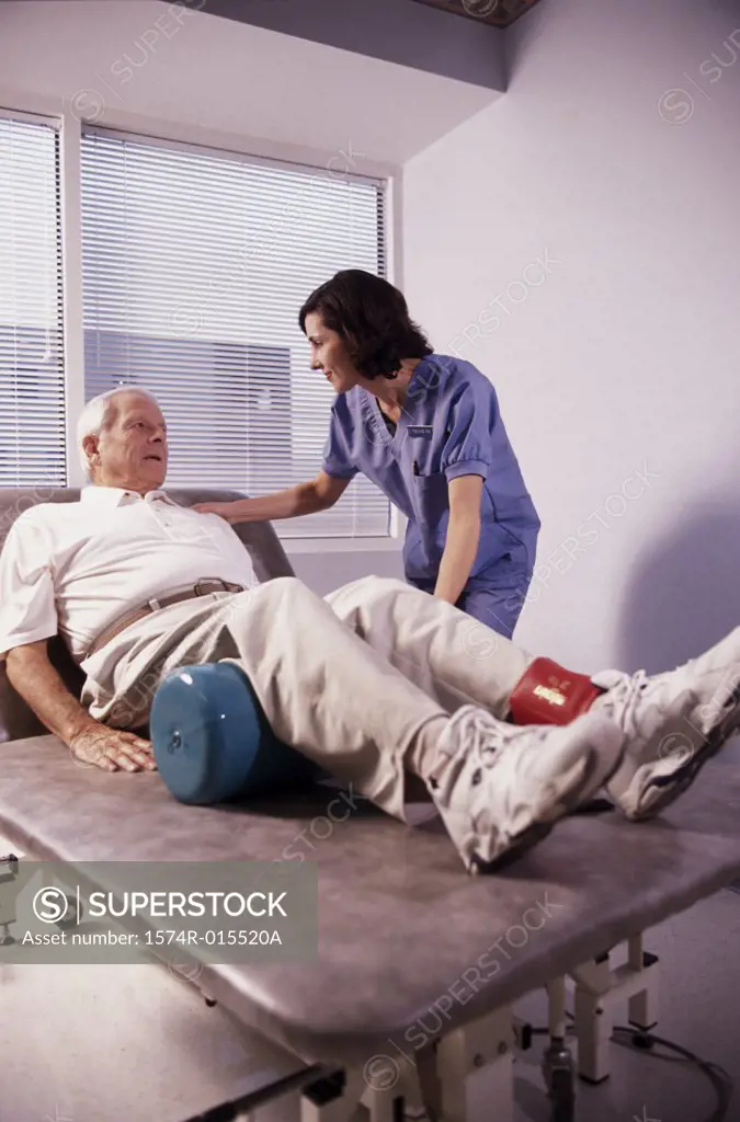 Side profile of a female nurse examining a patient