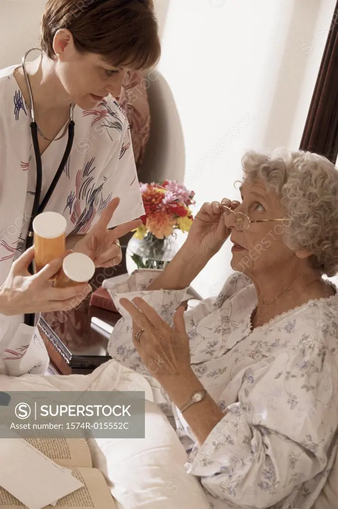 Close-up of a female nurse giving prescription to a patient