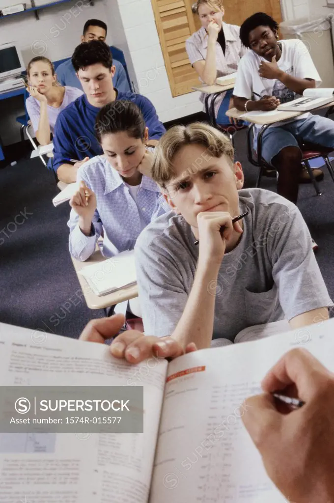 Group of high school students studying in a classroom