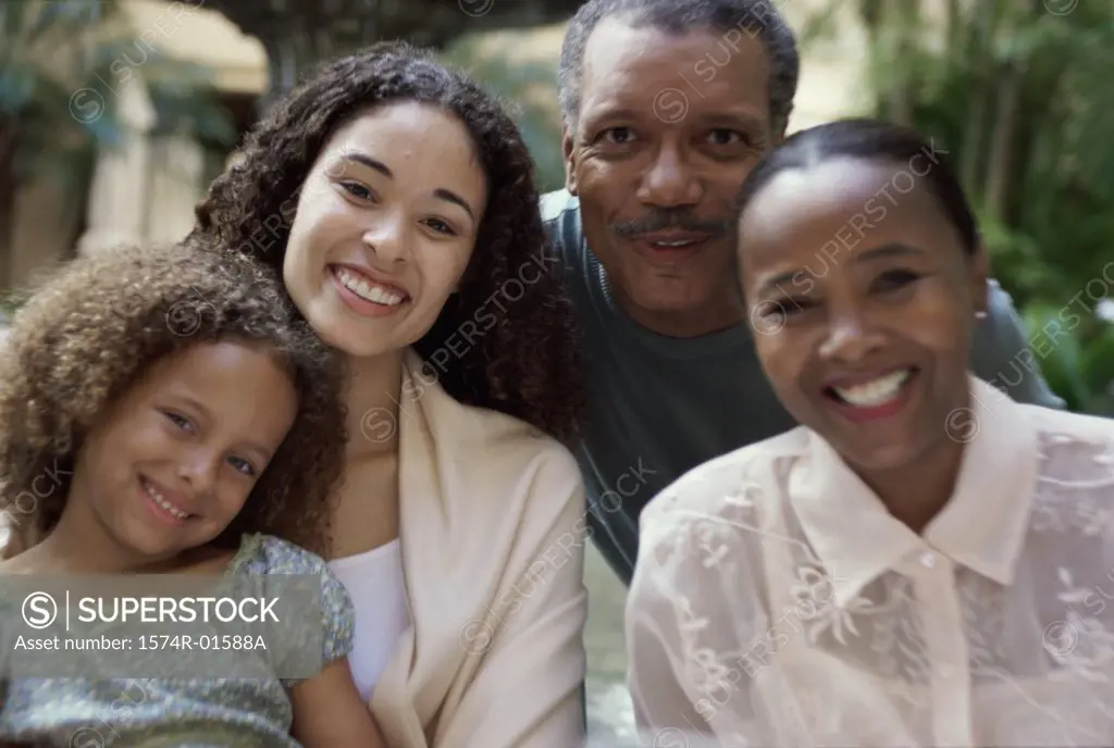 Portrait of grandparents with their daughter and their granddaughter